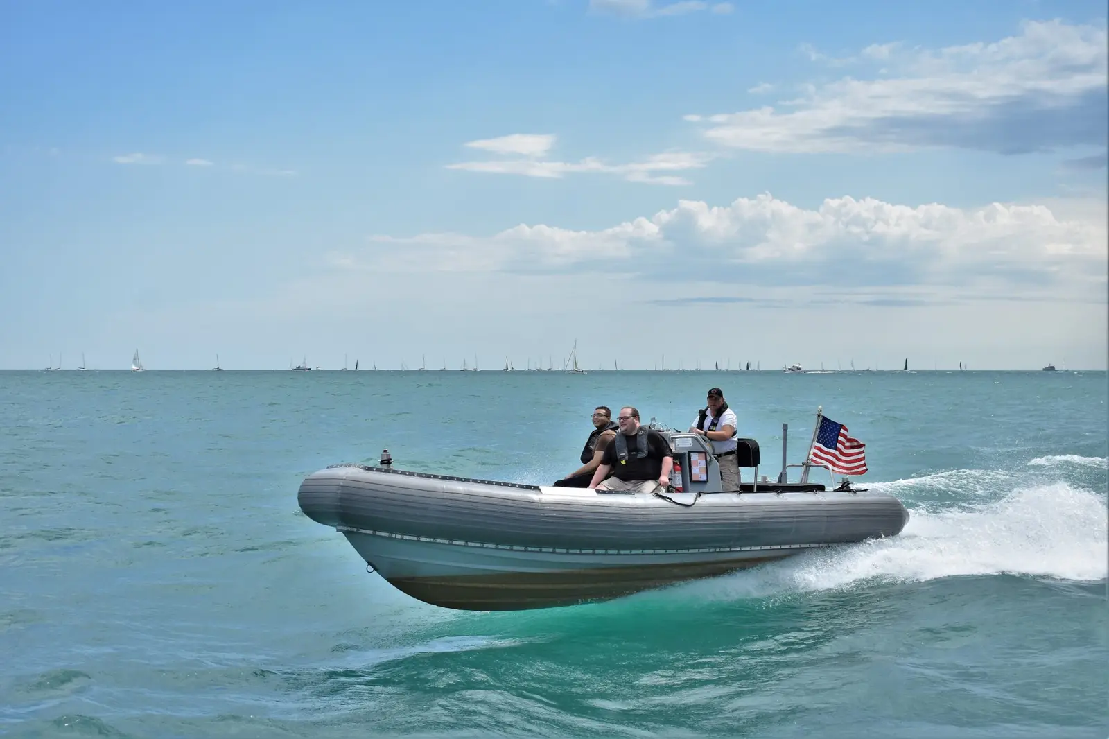 Guests cheering aboard a Blackhawk RHIB near downtown Chicago