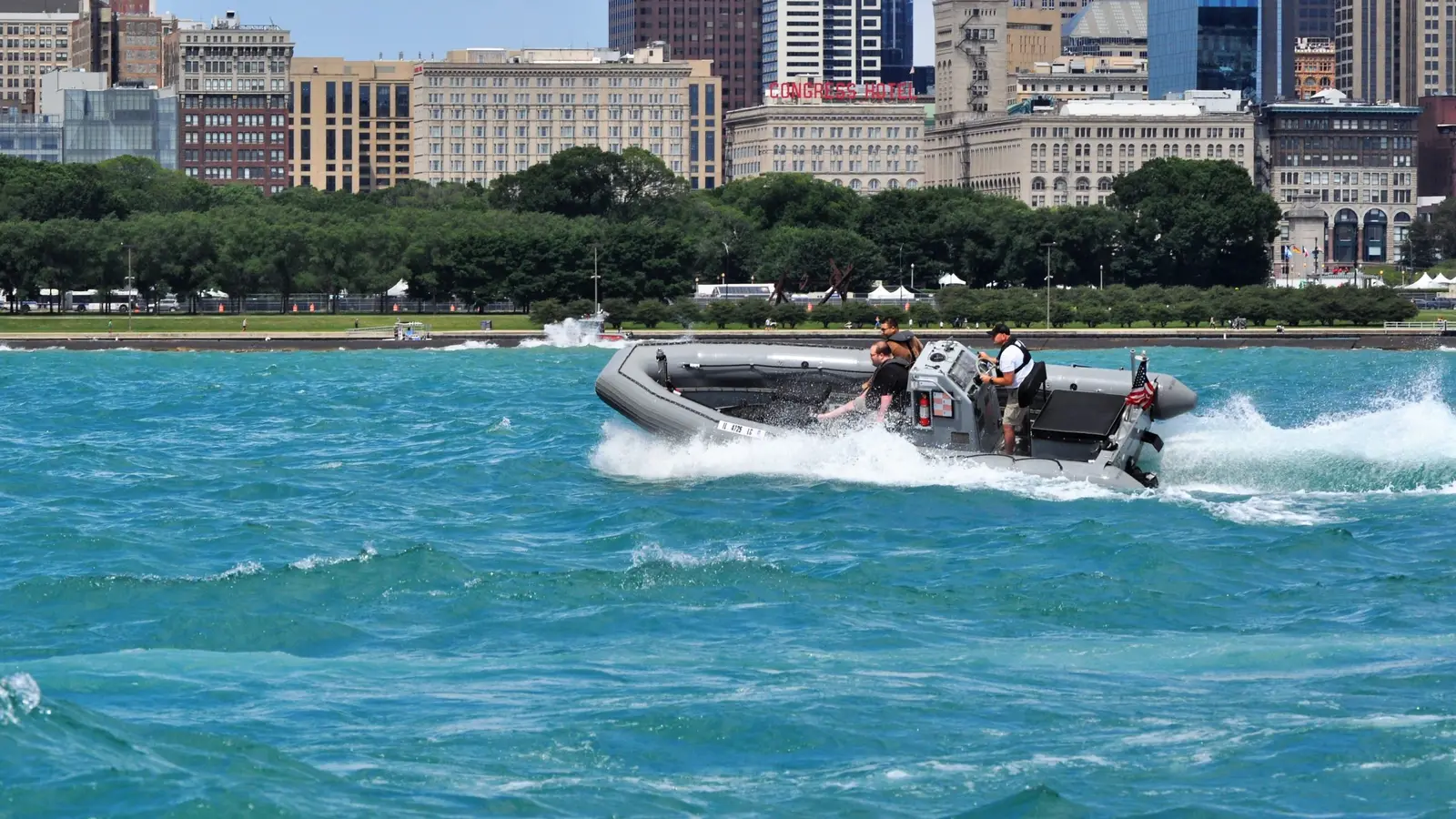 Guests riding the Blackhawk RHIB along the Chicago skyline